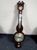 An antique banjo barometer by R Neale Hunton with silvered dial