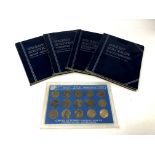Four British coin folders (partially complete) and a brass threepence collection 1967.