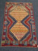 A Baluchi rug, 118cm by 77cm.