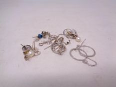 Ten pairs of silver earrings