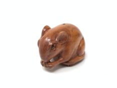 A carved Chinese hardwood netsuke - Rat eating corn