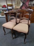 A set of four antique dining chairs on cabriole legs