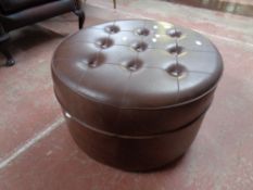 A 20th century Sherborne circular vinyl footstool