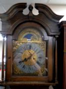 A 20th century oak cased longcase clock with brass moon phase dial,