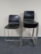 A set of six contemporary stacking breakfast bar stools on metal legs