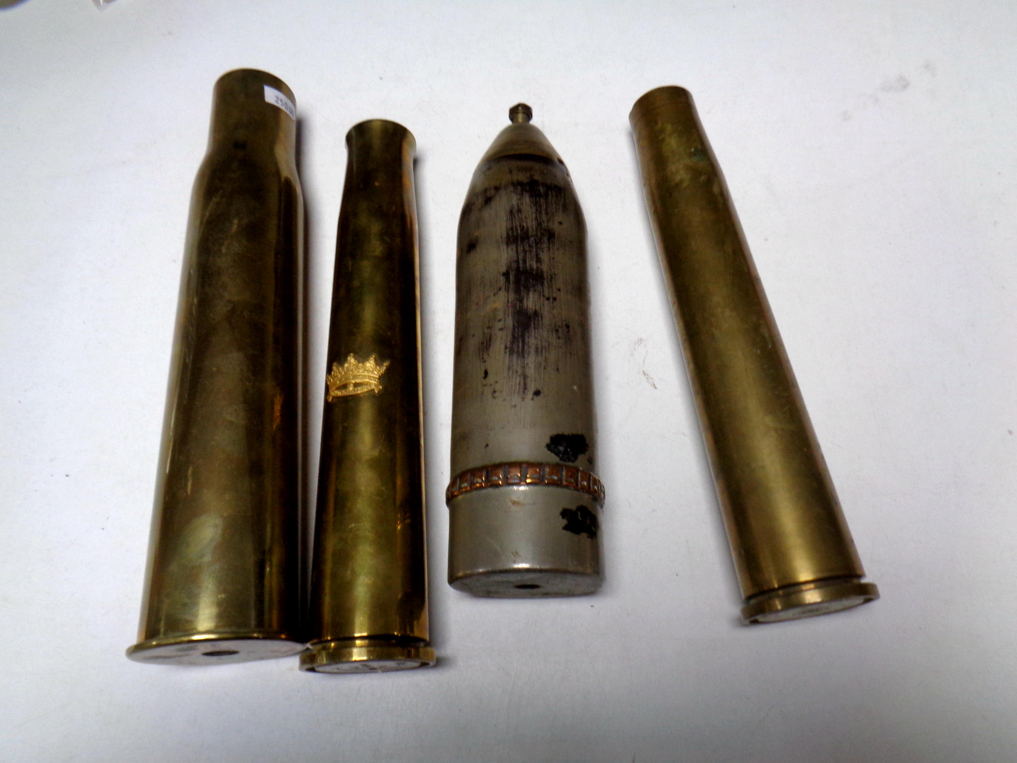 Four brass ammunition shells