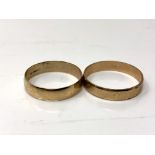Two 9ct gold band rings. CONDITION REPORT: 3.