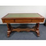 A 19th century mahogany library table fitted three drawers with a leather inset panel and under