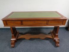 A 19th century mahogany library table fitted three drawers with a leather inset panel and under