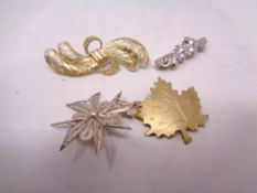 Four silver brooches