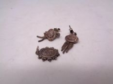 A vintage silver pendant and earrings