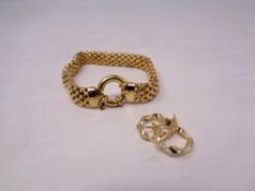 A gold plated on silver bracelet with earrings