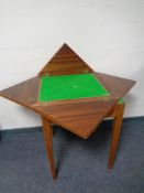 An inlaid satinwood and walnut envelope card table