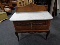 A continental marble topped wash stand fitted two drawers