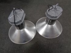 A pair of industrial style pendant light fittings,