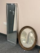 A contemporary rectangular silvered mirror 36 cm x 110 cm, together with an antique bevelled mirror.