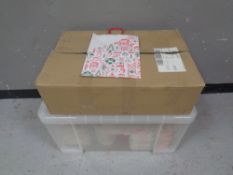 A box and a crate containing Christmas paper bags