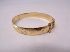 A 9ct gold plated on silver bangle