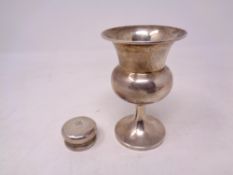 A silver goblet and pill box