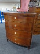 A late 19th century continental mahogany bow fronted four drawer chest