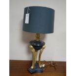 A metal and brass Art Deco style table lamp with shade