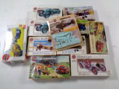 A tray containing 12 assorted vintage Airfix kits to include model aircraft, historic cars,