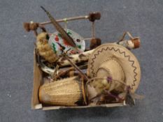 A box containing a quantity of tourist pieces to include dream catchers, hand drum,