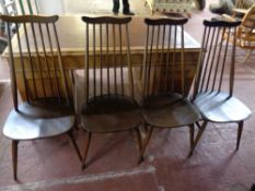 A set of four Ercol solid stained elm and beech high back dining chairs