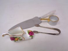 A bone china shoe together with miniature china pan,