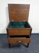 A mid 20th century oak sewing box