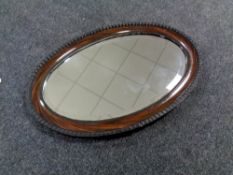 An oval Edwardian mirror