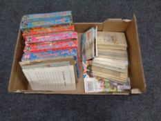 A box of mid 20th century jigsaws and a quantity of tea cards in albums