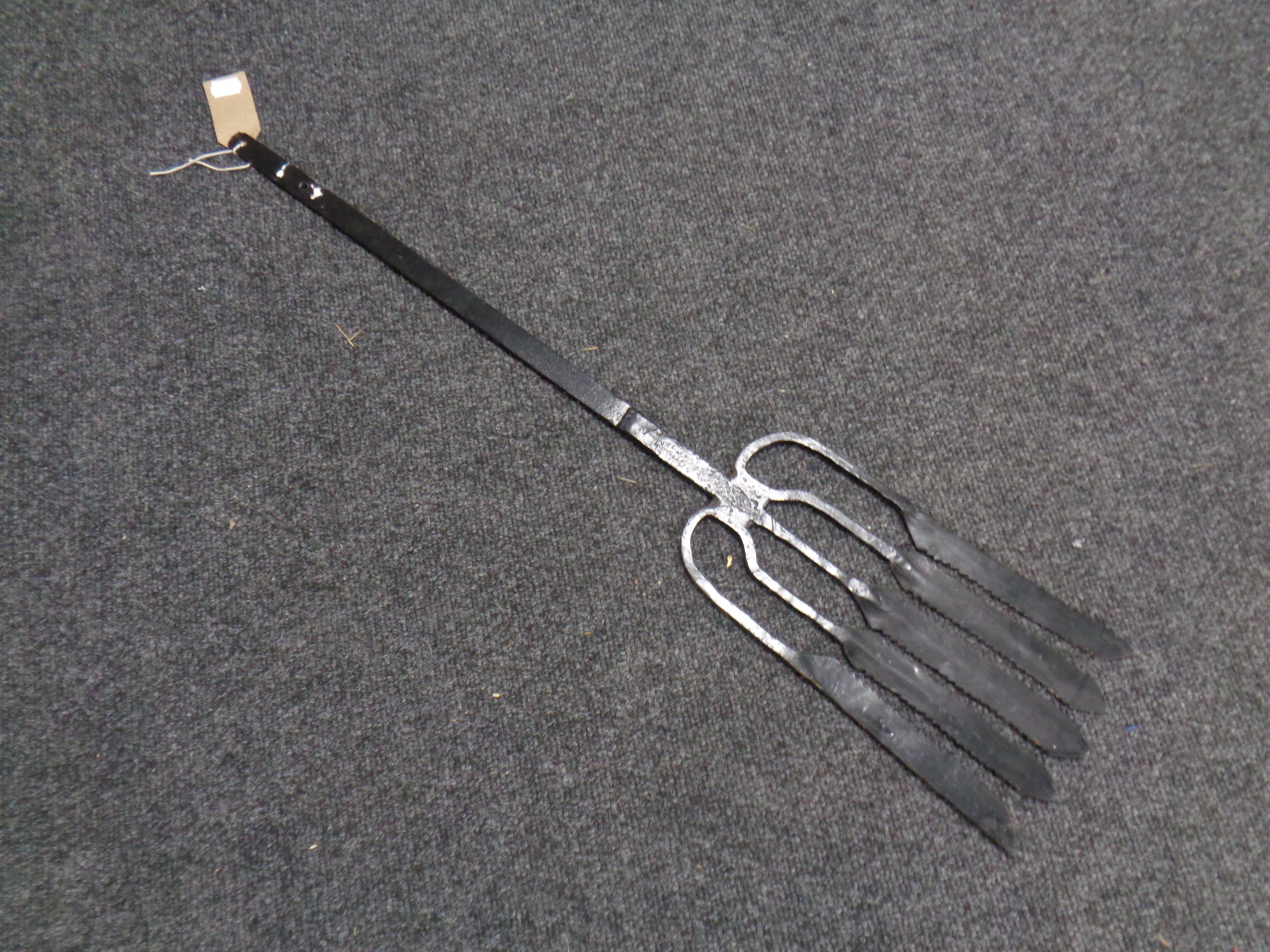 A large cast iron eel fork