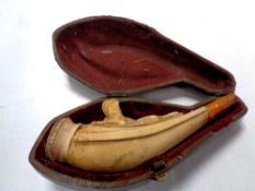 A cased 19th century pipe