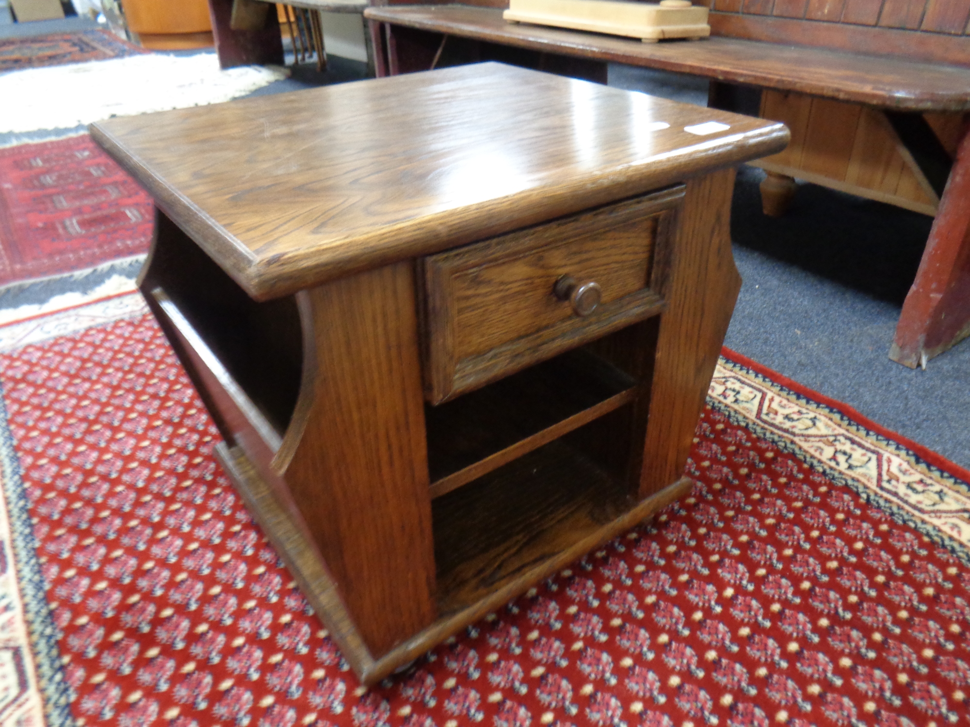 A magazine lamp table fitted a drawer in an oak finish