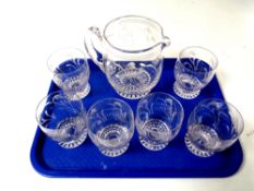 A Stuart crystal water jug with six glasses.