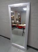 A contemporary silvered wall mirror