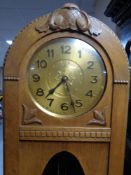 A 20th century oak cased regulator clock with pendulum and weights