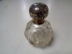 An etched glass silver topped scent bottle, London marks.