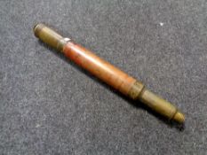 An early 20th century brass and wood nautical telescope.