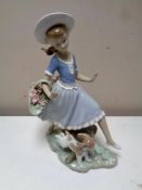A Lladro figure : Skipping girl with puppy
