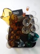 A tray of 20th century glass ware to include amber glass water jug and beakers,