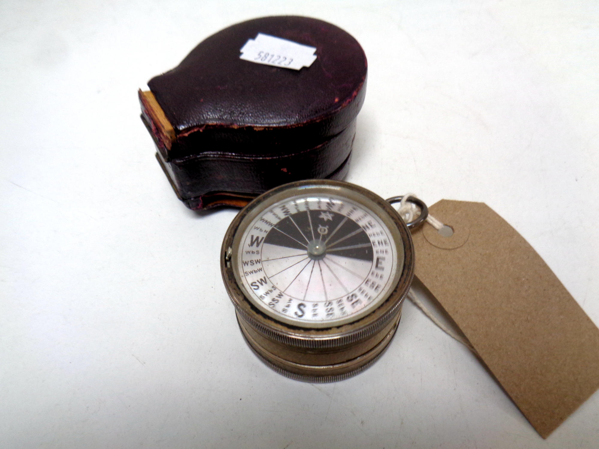 A C W Dixey & Son, Opticians to the Queen, silver cased pocket barometer/compass in a fitted case.