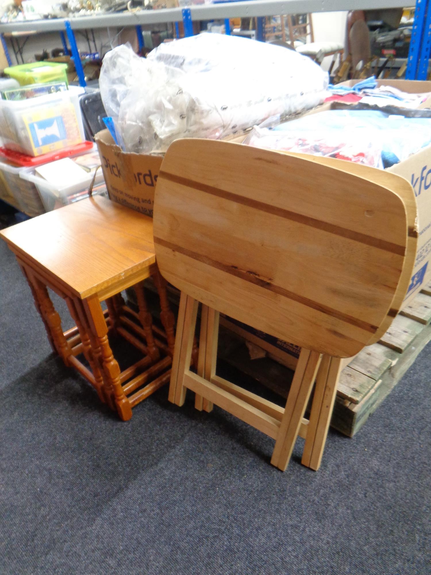 Two folding pine occasional tables and a nest of tables