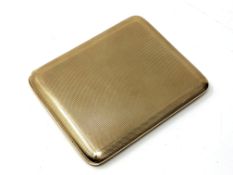 A 9ct gold cigarette case with engine turned decoration, London marks, maker's mark rubbed, 10.