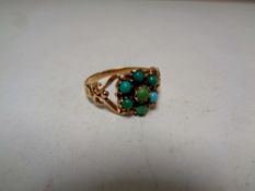 An antique turquoise cluster ring, marks rubbed.