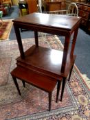 A 20th century nest of three tables and a lamp table