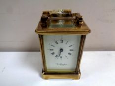 A Wellington brass cased presentation mantel clock with key