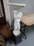 A painted concrete cherub bird bath on plinth (3)