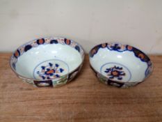 A pair of graduated Imari bowls.